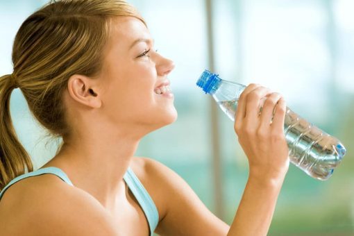 A woman smiling after taking her Alkemy Power supplement